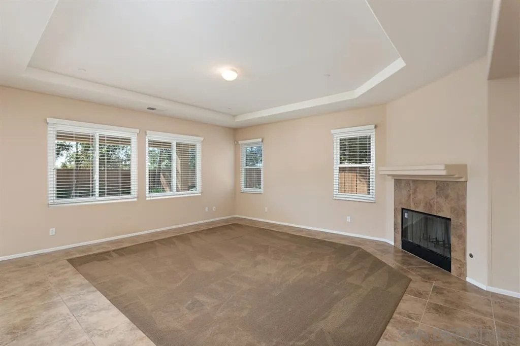 1757 Monte Mar Road Vista, CA 92084 - Photo 6 of 25 an empty room with windows and fireplace