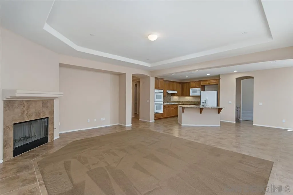 1757 Monte Mar Road Vista, CA 92084 - Photo 7 of 25 a view of an empty room with a fireplace