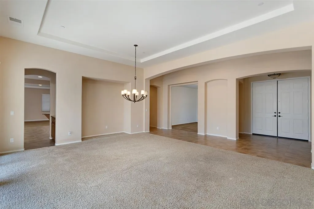 1757 Monte Mar Road Vista, CA 92084 - Photo 9 of 25 an empty room with fan and windows