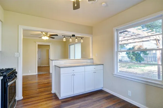 a spacious bathroom with a double vanity sink and a large mirror