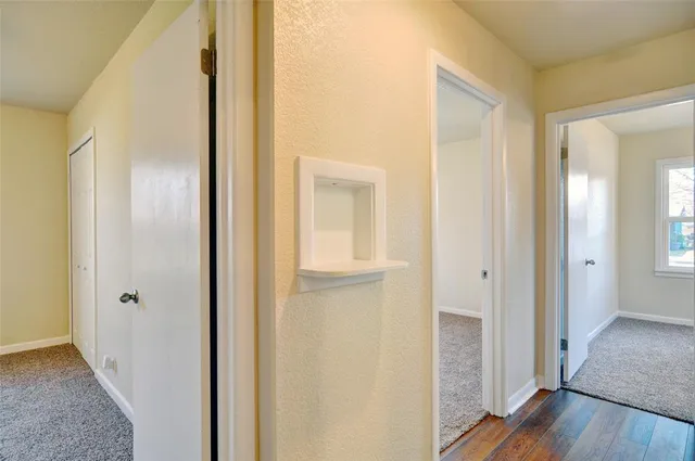 a view of a bathroom from a hallway