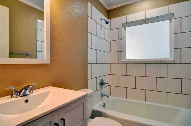 a bathroom with a sink and a bathtub