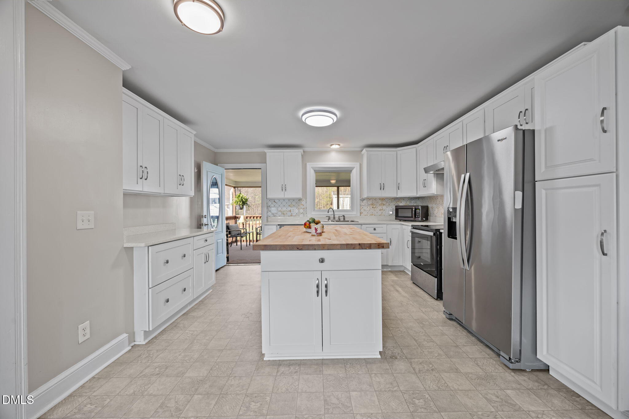 10612 Durham Road Timberlake, NC 27583 - Photo 11 of 42 a kitchen with stainless steel appliances a refrigerator sink and cabinets