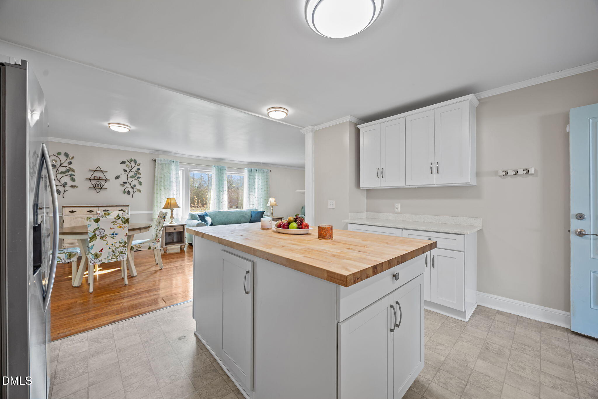10612 Durham Road Timberlake, NC 27583 - Photo 13 of 42 a kitchen with a stove a table and chairs