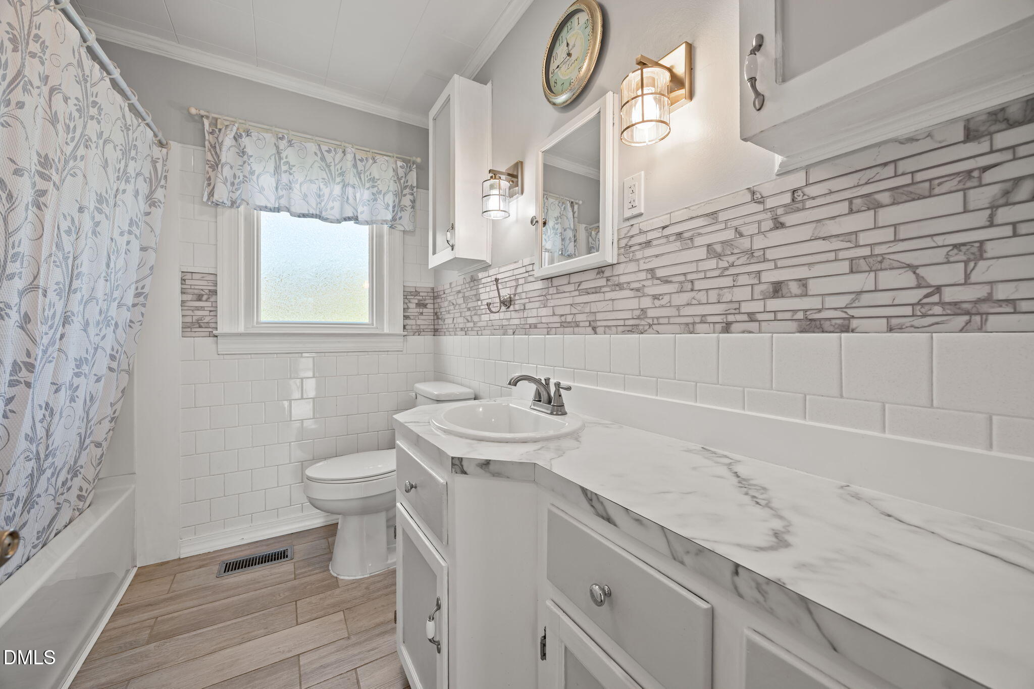 10612 Durham Road Timberlake, NC 27583 - Photo 17 of 42 a bathroom with a sink a toilet and a mirror