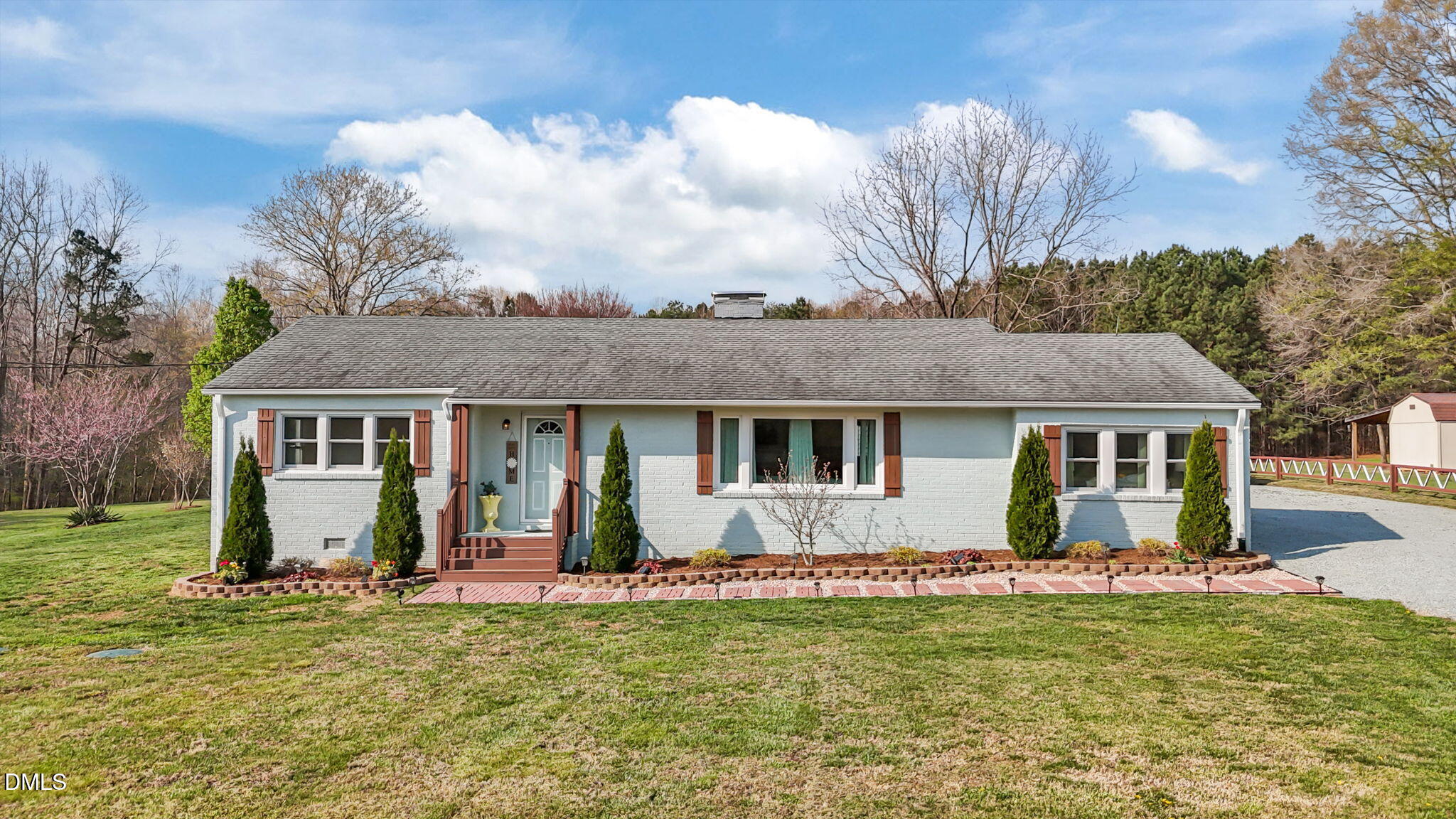 10612 Durham Road Timberlake, NC 27583 - Photo 2 of 42 a view of a house with a yard