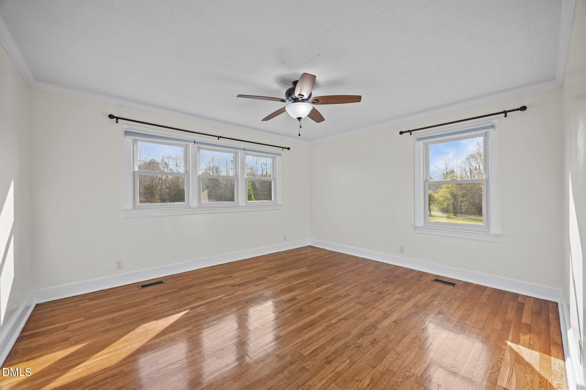10612 Durham Road Timberlake, NC 27583 - Photo 21 of 42 a view of empty room with wooden floor and fan