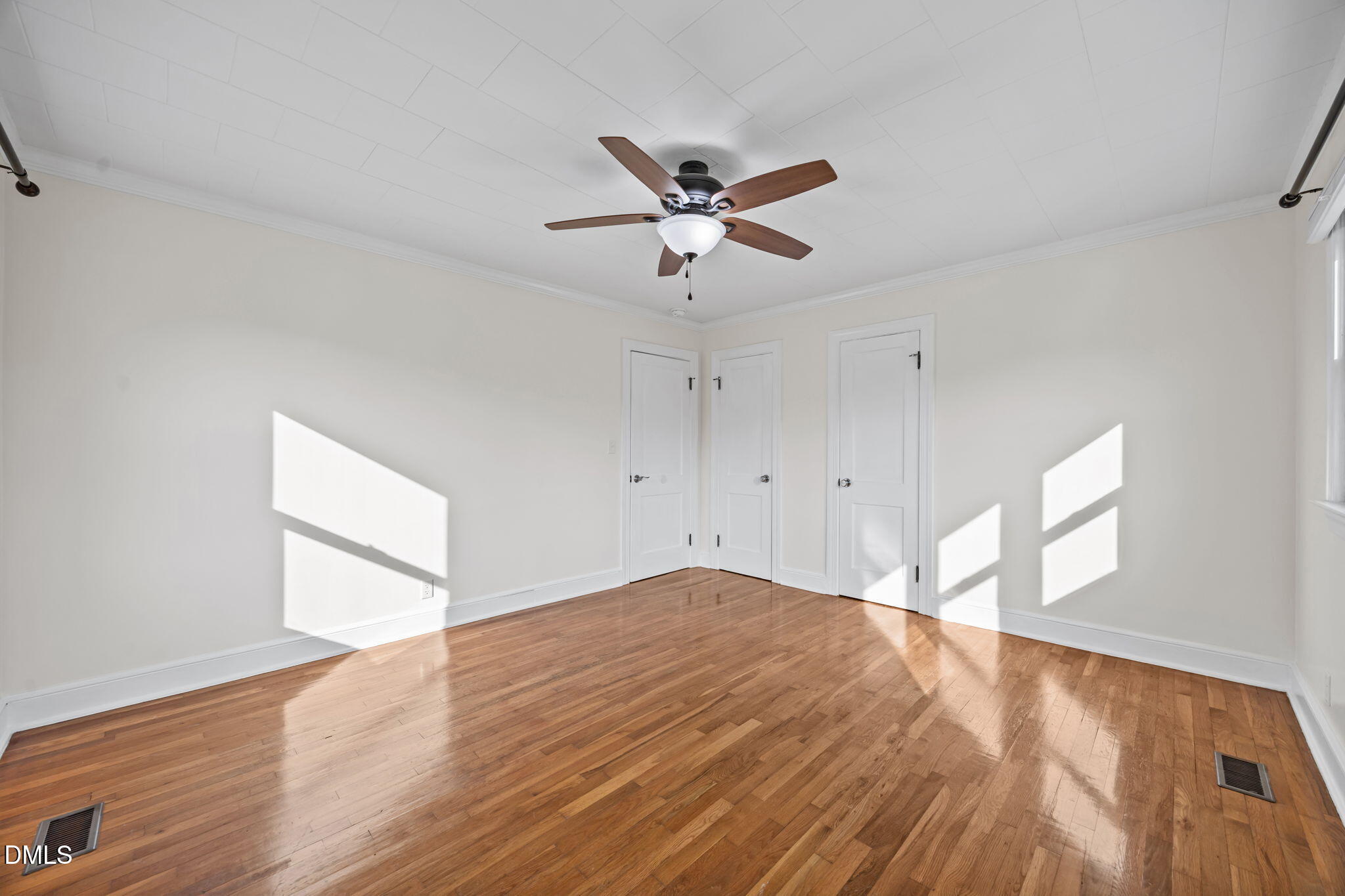10612 Durham Road Timberlake, NC 27583 - Photo 22 of 42 a view of empty room with wooden floor and fan