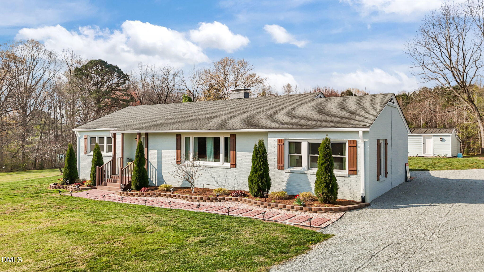10612 Durham Road Timberlake, NC 27583 - Photo 3 of 42 a front view of a house with a yard
