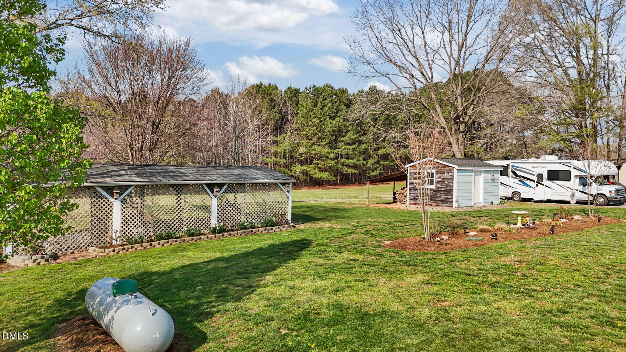 10612 Durham Road Timberlake, NC 27583 - Photo 33 of 42 a front view of a house with garden