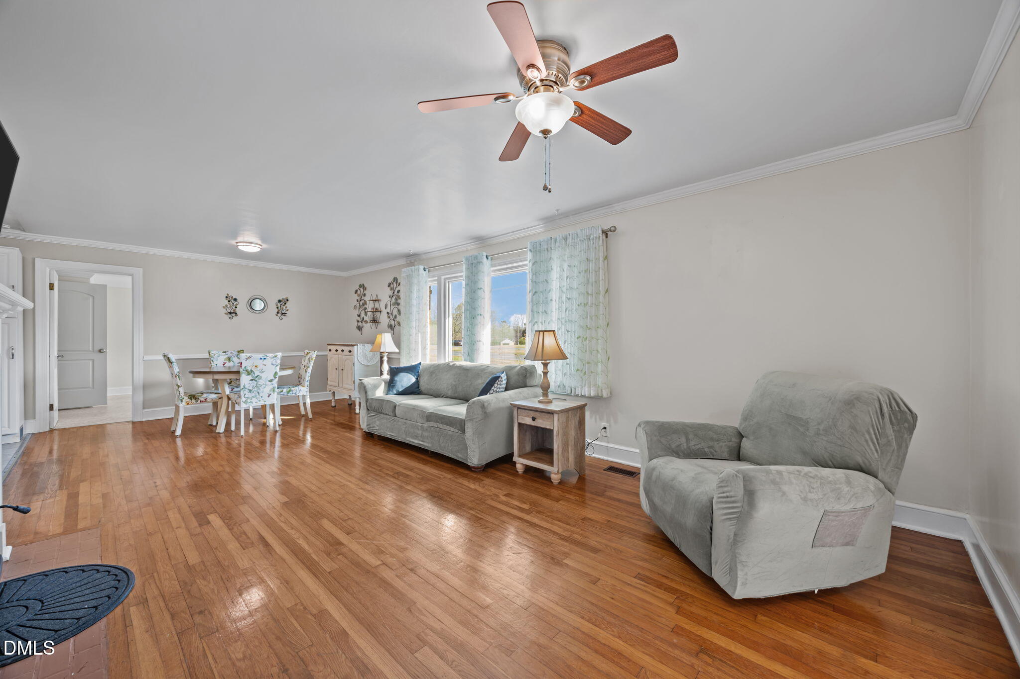 10612 Durham Road Timberlake, NC 27583 - Photo 6 of 42 a living room with furniture and a wooden floor