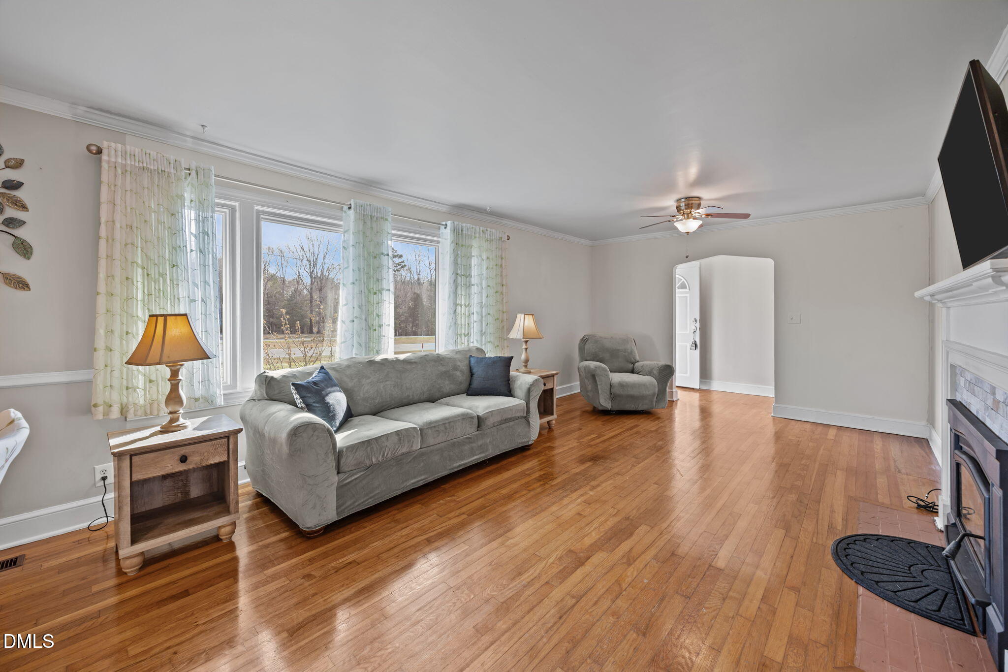 10612 Durham Road Timberlake, NC 27583 - Photo 9 of 42 a living room with furniture and a flat screen tv