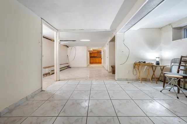 a view of a livingroom with furniture and an entryway