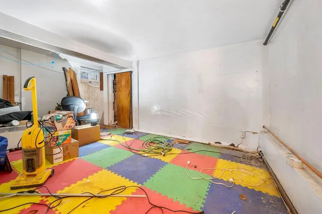 a bed room with a bed and a mirror