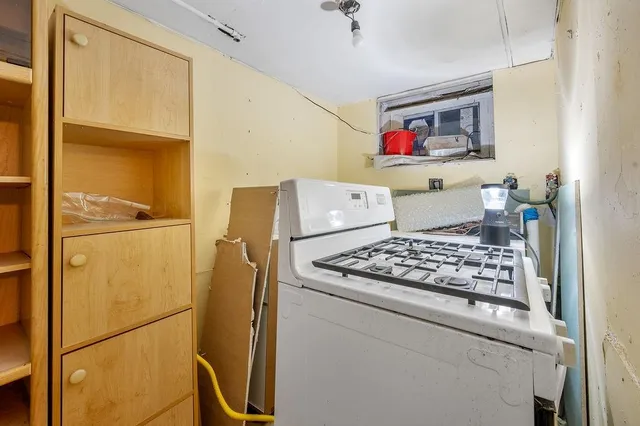 a kitchen with stainless steel appliances granite countertop a refrigerator and a stove