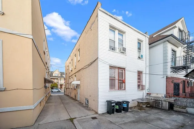 a view of a house with a barbeque