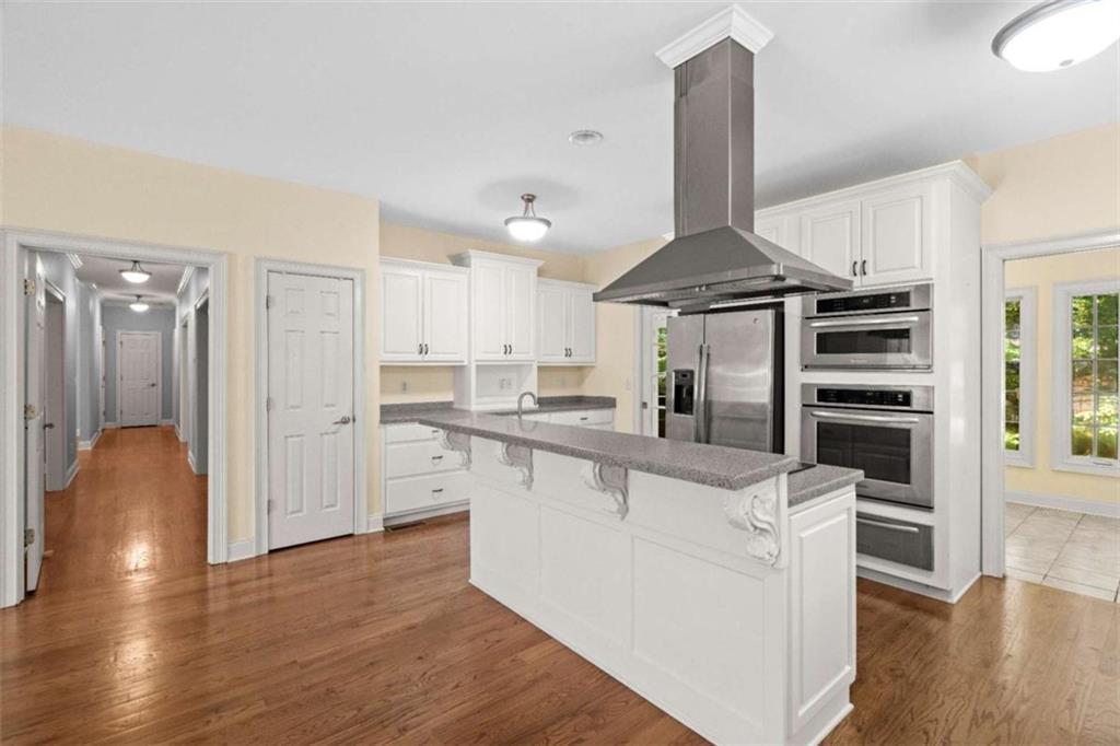 2058 Sewanee Court Villa Rica, GA 30180 - Photo 13 of 81 a kitchen with stainless steel appliances a refrigerator and a stove top oven
