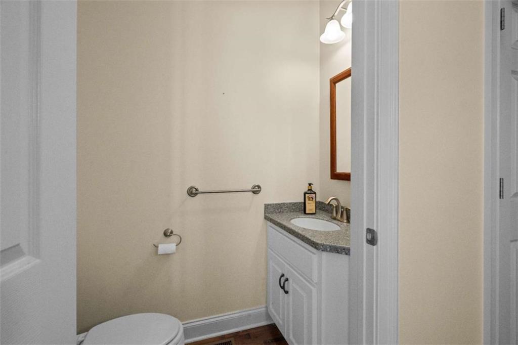 2058 Sewanee Court Villa Rica, GA 30180 - Photo 18 of 81 a bathroom with a sink and mirror with toilet