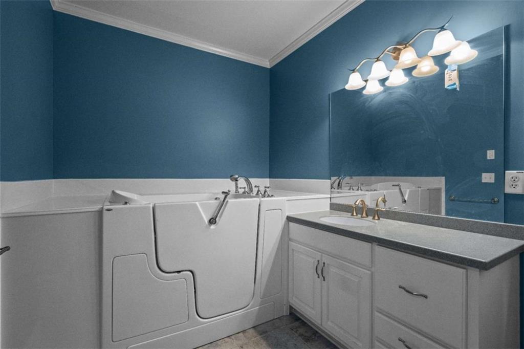 2058 Sewanee Court Villa Rica, GA 30180 - Photo 26 of 81 a bathroom with a sink vanity and mirror