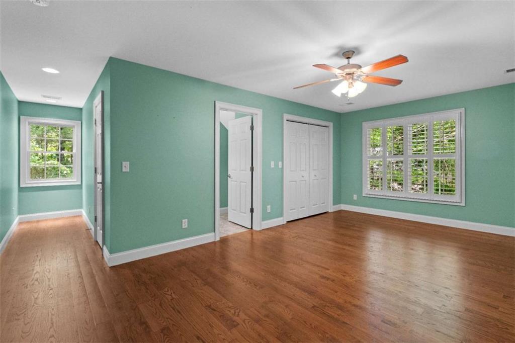 2058 Sewanee Court Villa Rica, GA 30180 - Photo 33 of 81 wooden floor in an empty room with a window