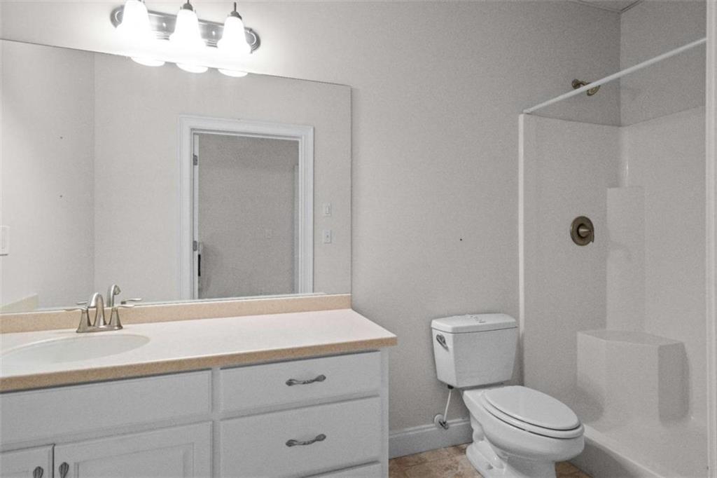 2058 Sewanee Court Villa Rica, GA 30180 - Photo 51 of 81 a bathroom with a sink a toilet and shower