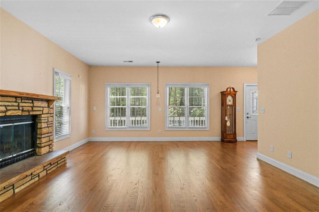 2058 Sewanee Court Villa Rica, GA 30180 - Photo 59 of 81 a view of an empty room with wooden floor and a window