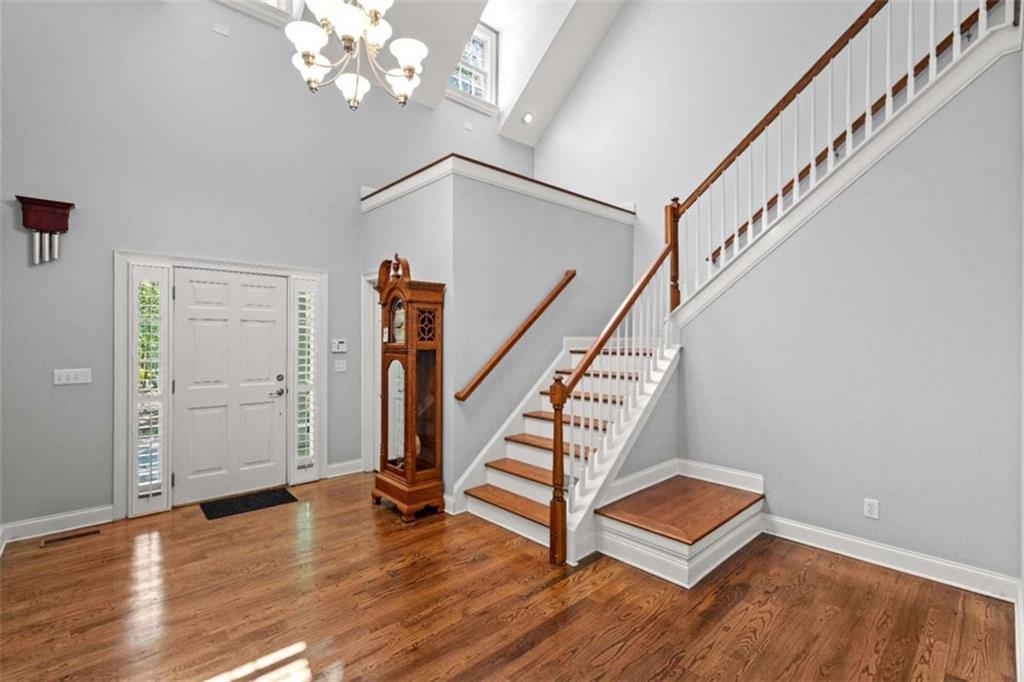 2058 Sewanee Court Villa Rica, GA 30180 - Photo 6 of 81 a view of entryway with wooden floor and stairs