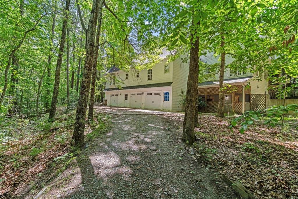 2058 Sewanee Court Villa Rica, GA 30180 - Photo 68 of 81 a view of a house with large trees