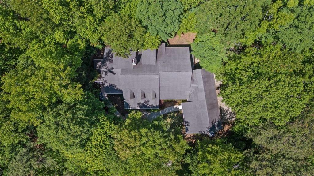 2058 Sewanee Court Villa Rica, GA 30180 - Photo 71 of 81 an aerial view of a house with a yard and large trees