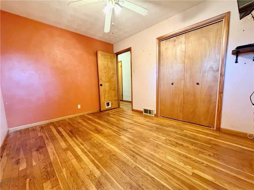 121 Kemar Drive Butler, PA 16002 - Photo 14 of 31 a view of an empty room with wooden floor and a window