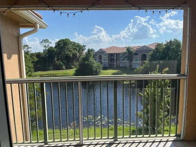 a view of a balcony with wooden fence and floor