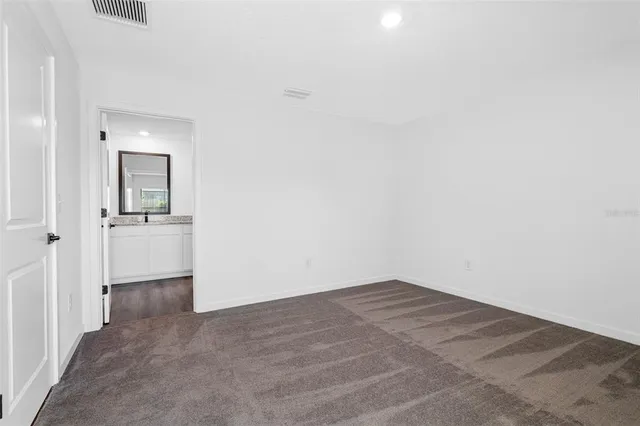 an empty room with a bathroom