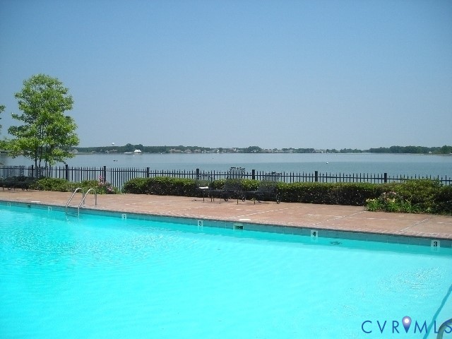 502 Smith Drive Ruther Glen, VA 22546 - Photo 32 of 34 a view of a lake with houses in the back