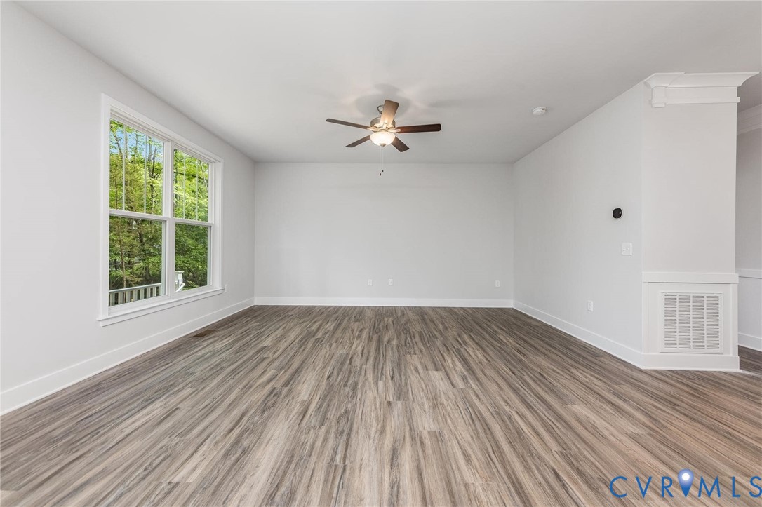 502 Smith Drive Ruther Glen, VA 22546 - Photo 7 of 34 wooden floor in an empty room with a window