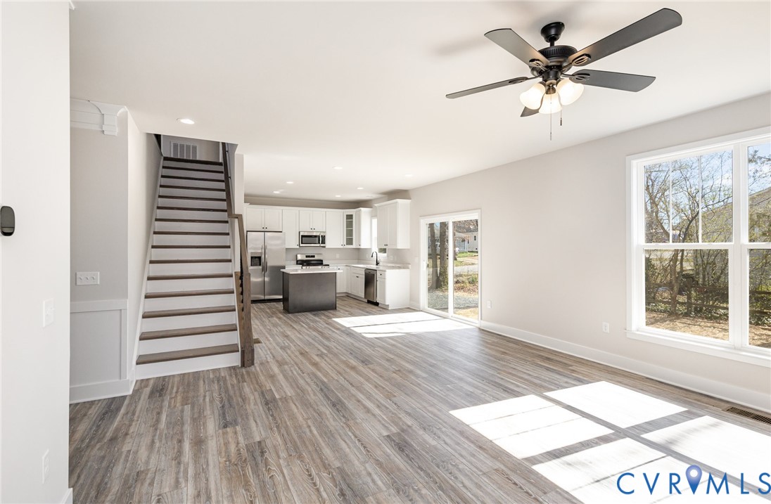 502 Smith Drive Ruther Glen, VA 22546 - Photo 8 of 34 wooden floor in an empty room with a window and wooden floor