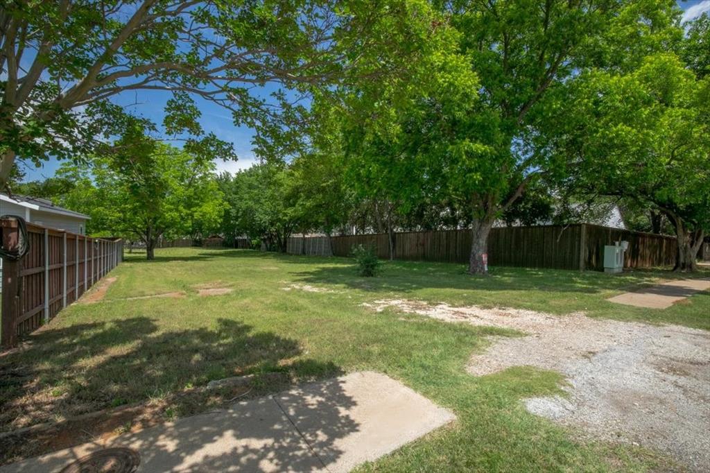 1000 Hughes Road Grapevine, TX 76051 - Photo 4 of 15 a backyard of a house with lots of green space