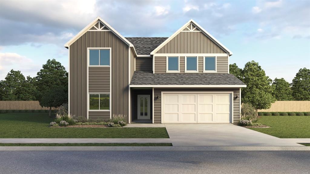 750 Sweet Pea Drive Pilot Point, TX 76258 - Photo 2 of 2 a front view of a house with a yard and garage