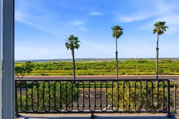 a view of a street with a balcony