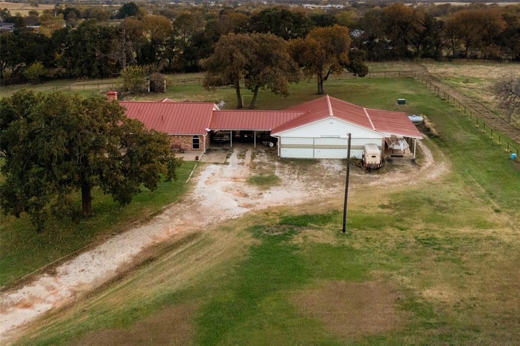 13633 Alexander Road Pilot Point, TX 76258 - Photo 4 of 4 a backyard of a house with yard and lake view