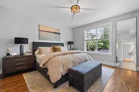 a bedroom with bed and a couch