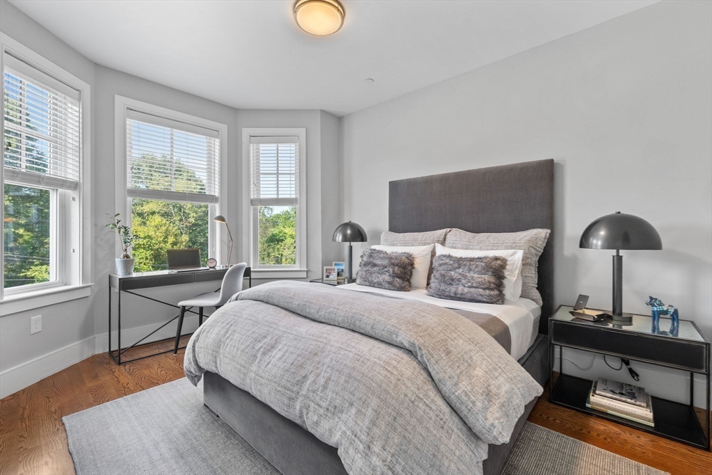 579 Baker Street, Unit 579 Boston, MA 02132 - Photo 18 of 30 a bed room with a bed and a window