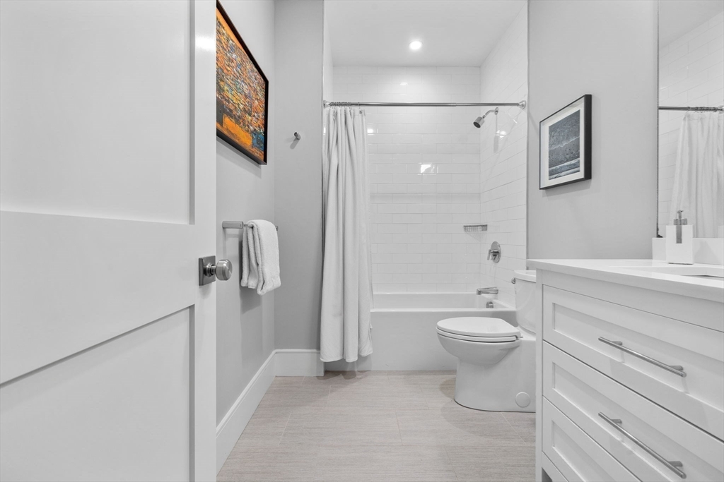 579 Baker Street, Unit 579 Boston, MA 02132 - Photo 20 of 30 a bathroom with a toilet sink and shower