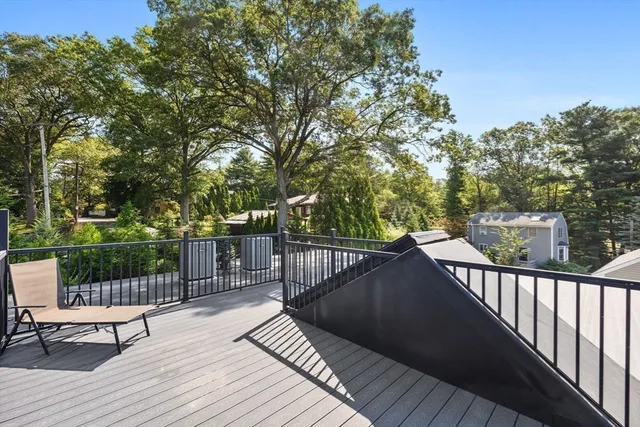 a view of a patio with table and chairs and potted plants