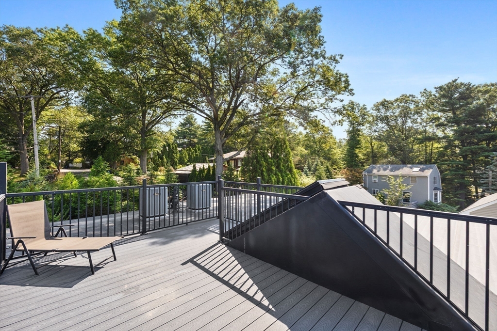 579 Baker Street, Unit 579 Boston, MA 02132 - Photo 23 of 30 a view of deck with wooden floor and outdoor seating