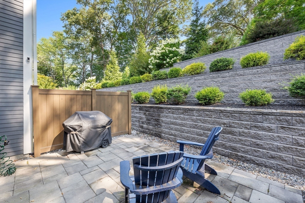 579 Baker Street, Unit 579 Boston, MA 02132 - Photo 24 of 30 a view of backyard with outdoor seating