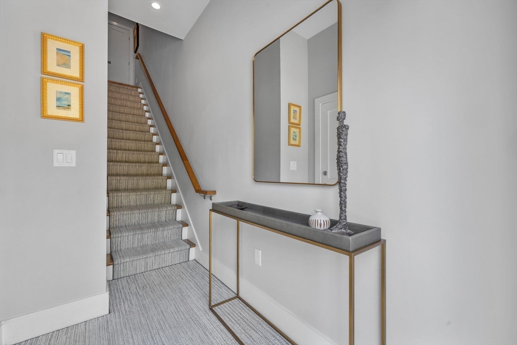 579 Baker Street, Unit 579 Boston, MA 02132 - Photo 28 of 30 a view of entryway and hall with wooden floor