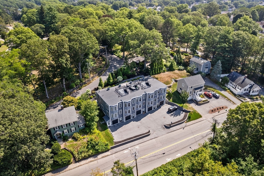 579 Baker Street, Unit 579 Boston, MA 02132 - Photo 29 of 30 an aerial view of a house with garden space and street view
