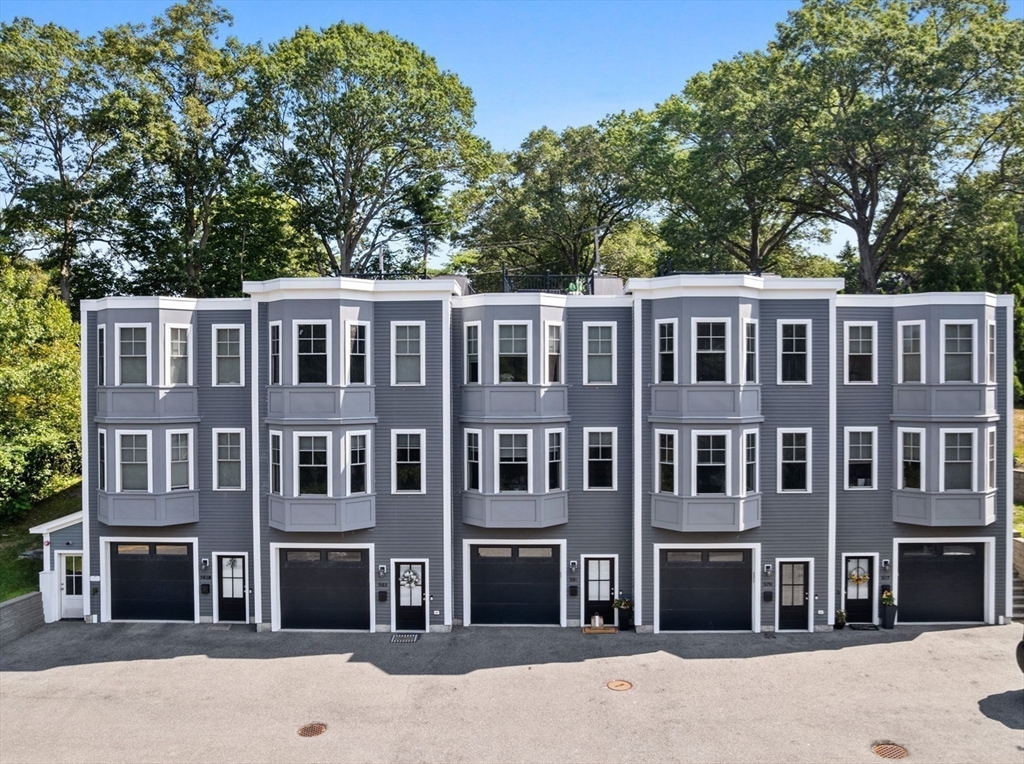 579 Baker Street, Unit 579 Boston, MA 02132 - Photo 30 of 30 a front view of a building with a garden