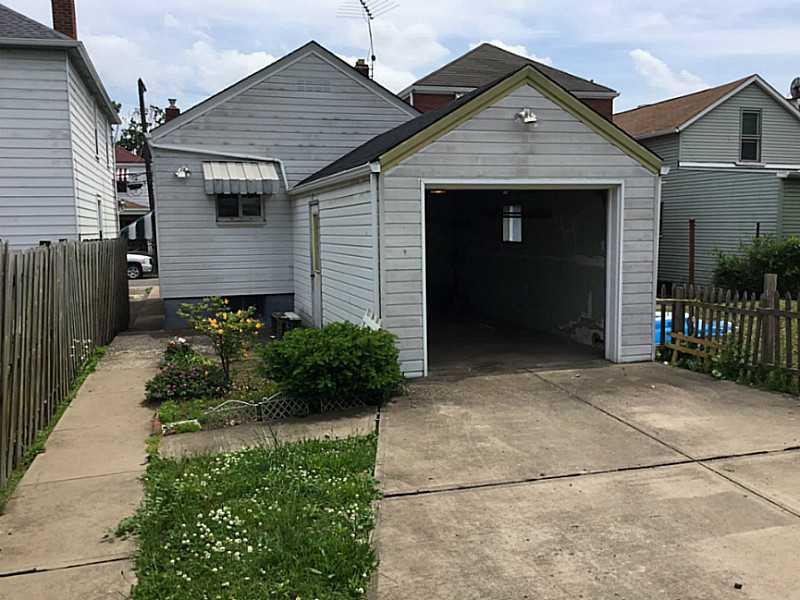 1126 9th Street McKees Rocks, PA 15136 - Photo 14 of 15 Parking Lot/Garage. 1 Car garage with parking for 2 more on driveway. On street parking out front as well