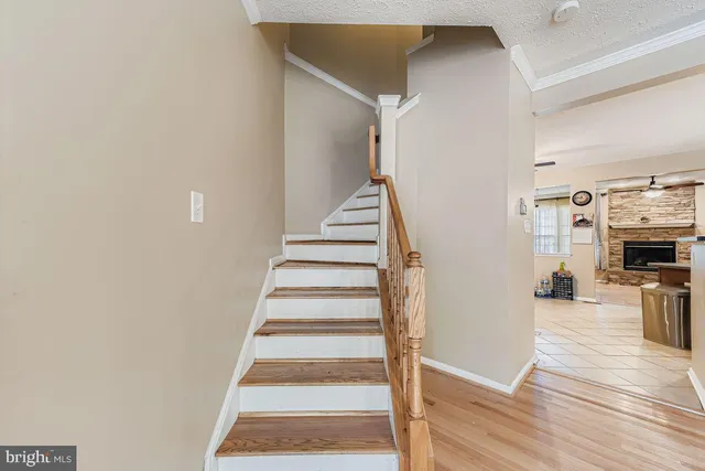 a view of a livingroom with wooden floor and furniture